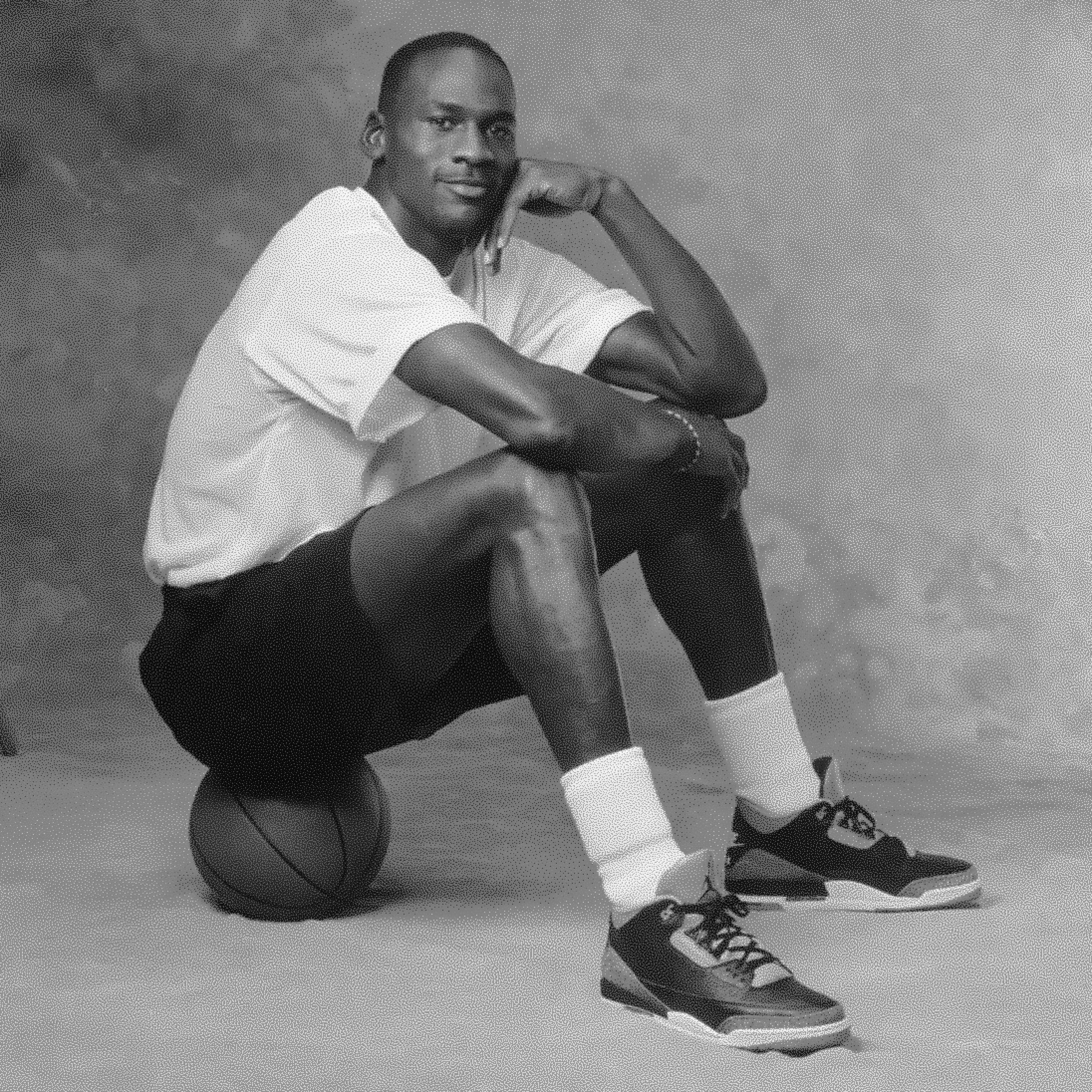 Michael Jordan sitting on basketball